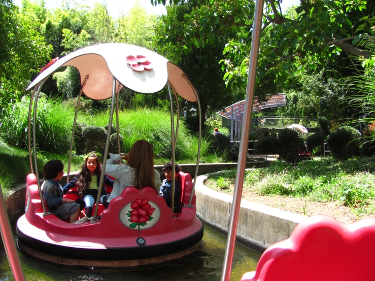 several s ride on a bumper boat in a river