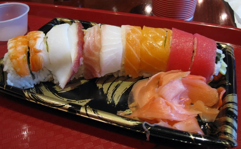 the plate has different kinds of sushi in it