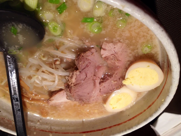 food is being prepared and served in a bowl