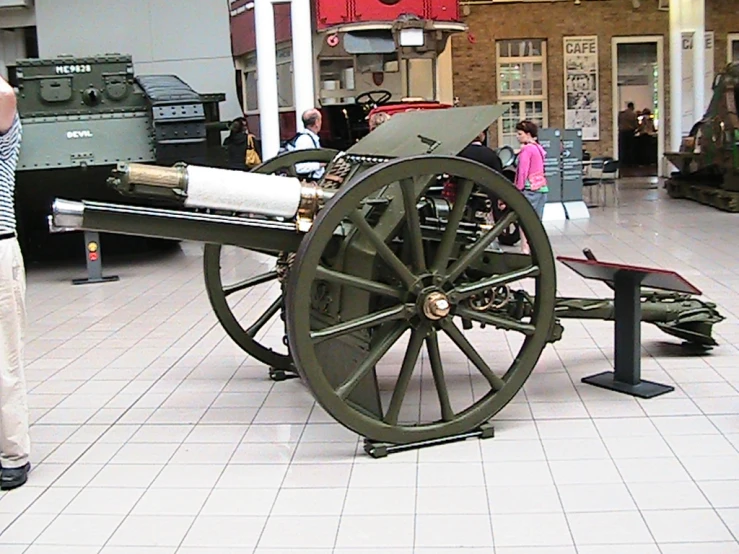 an old cannon on display in a mall