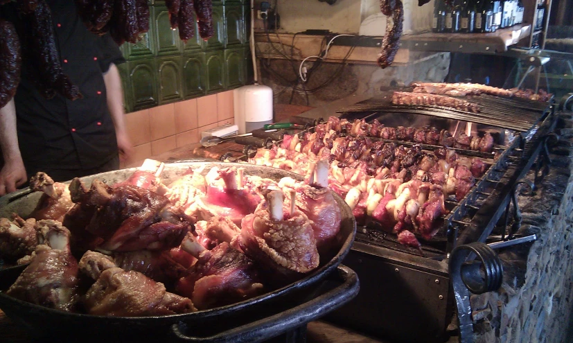 cooked meat is cooking over an oven