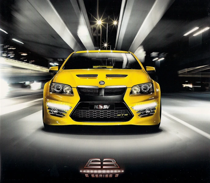an advertit featuring a yellow sports car driving through a tunnel