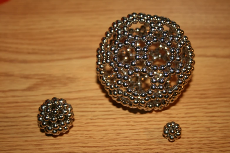 some beads and ons on a wooden table