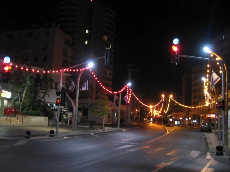 a red traffic light sitting next to a street