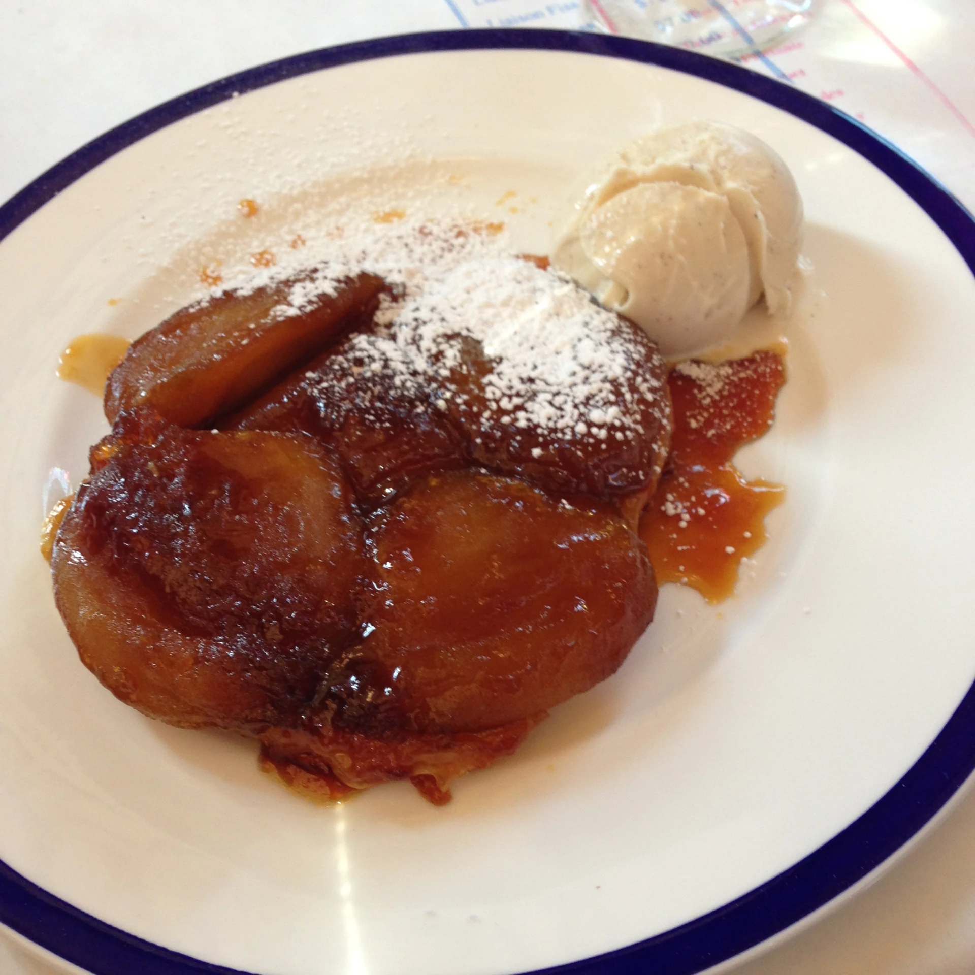 a white plate with dessert on it with ice cream