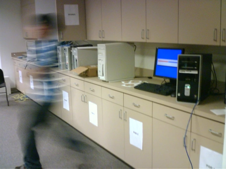 an employee is running in a filing cabinet