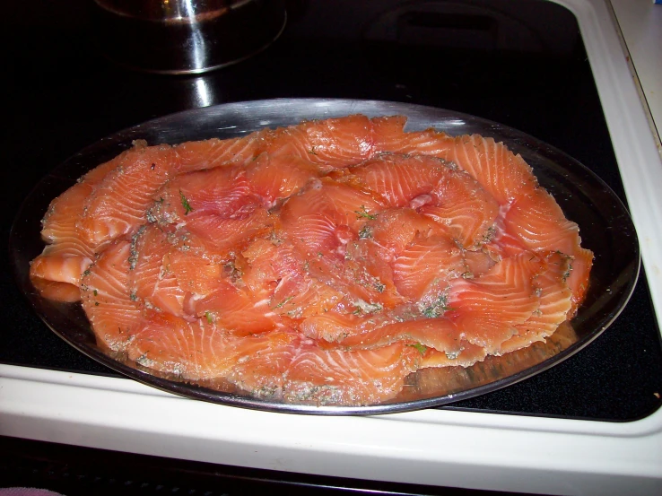 cooked salmon is sitting on the top of an oven rack