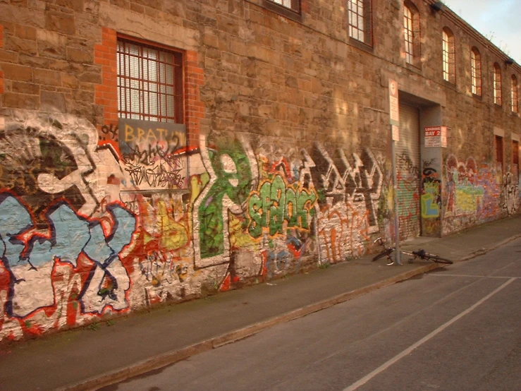 a large stone building covered in grafitti