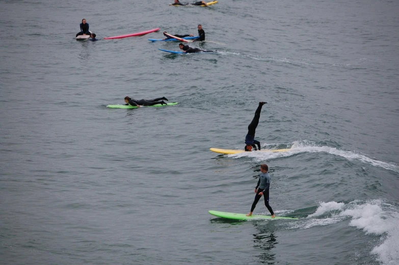 several people on surfboards in the ocean