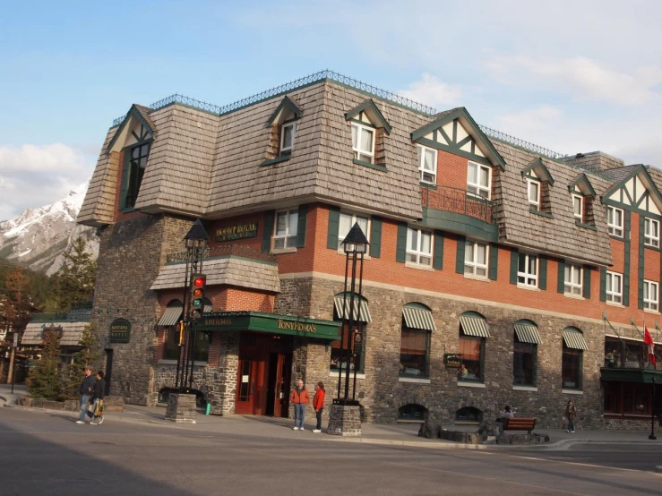 the building has a stone and wood exterior