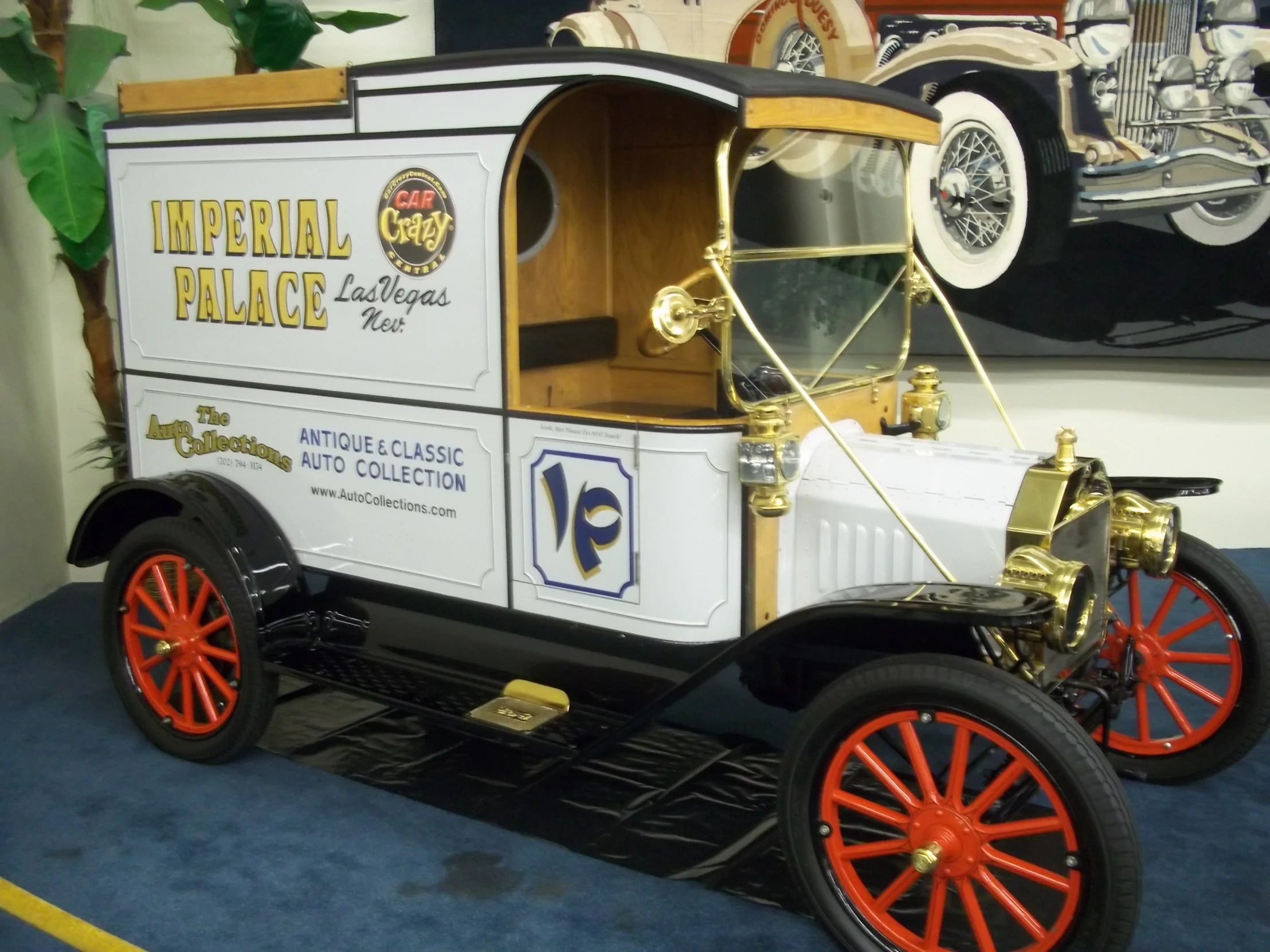 a white and yellow vehicle with orange rims on display