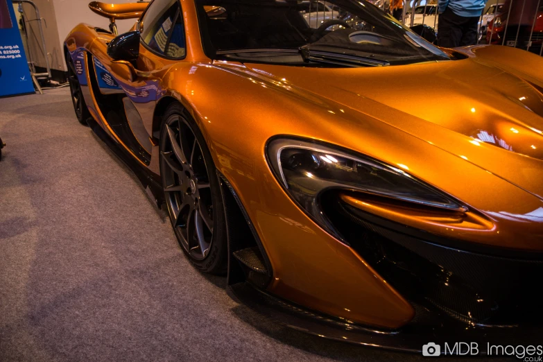 a yellow sports car parked in a room