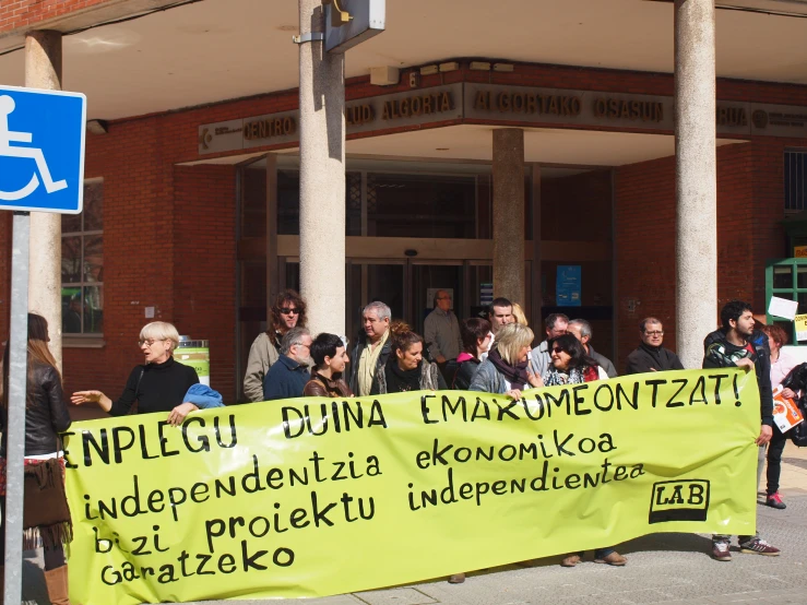 an image of a group of people protesting in front of the courthouse