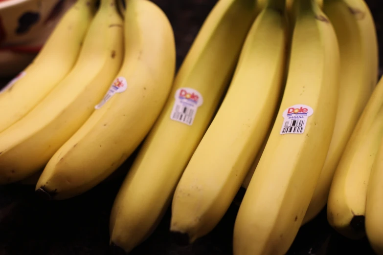 some yellow bananas sitting next to each other