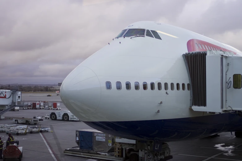 an airplane that is parked on the concrete