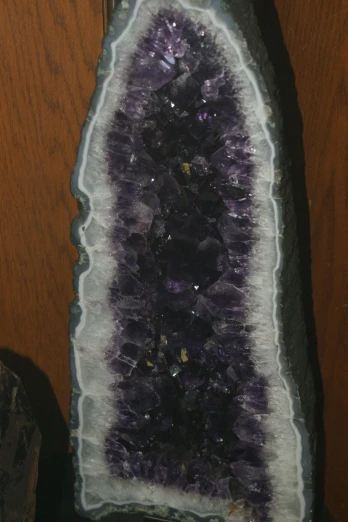 an ornate purple and white glass object with a unique design