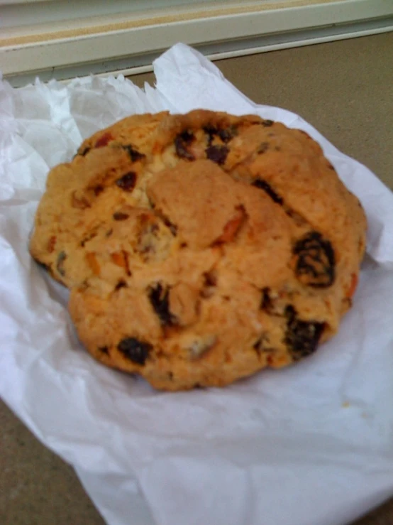 there is an odd looking cookie sitting on a piece of paper