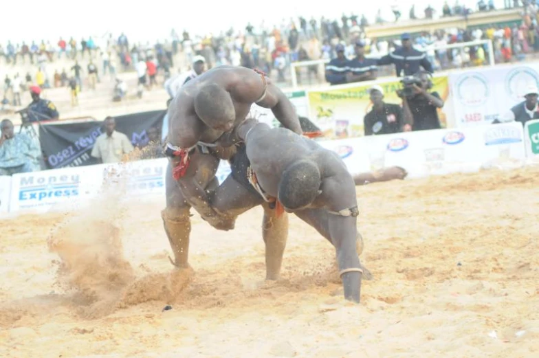 a man on one foot trying to grab a calf