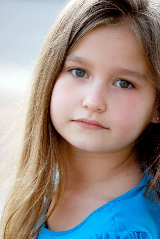 a little girl looking at the camera and staring