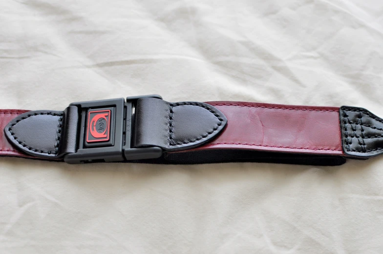 red and black straps are on the white fabric