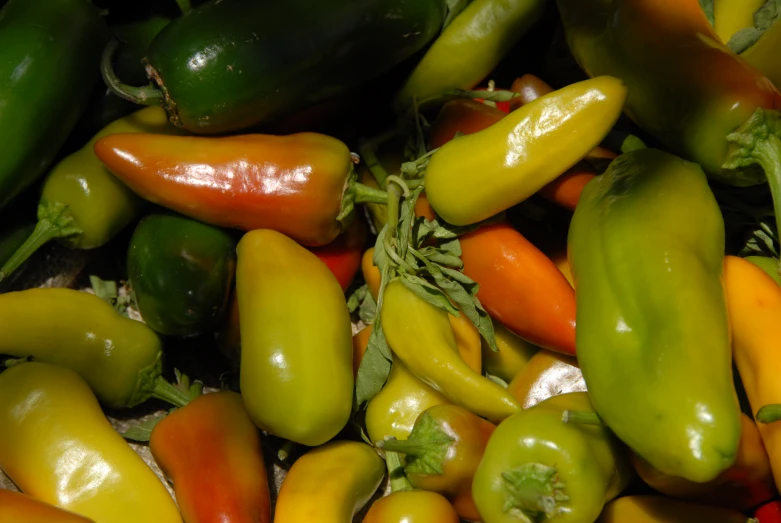 a pile of  peppers that are next to each other