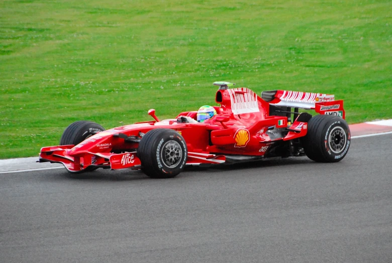 a red race car with one wheel that has been taken off
