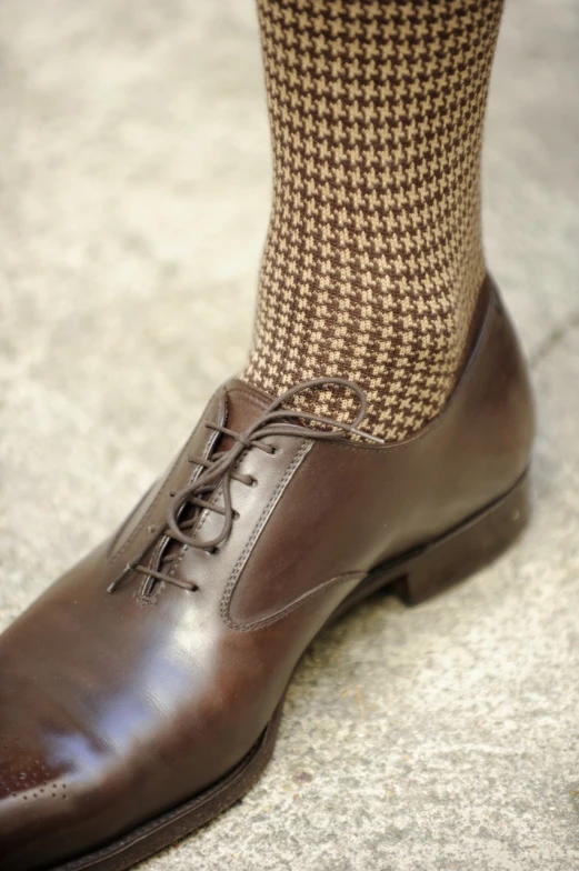 the brown lace up dress shoes show off the argyle socks