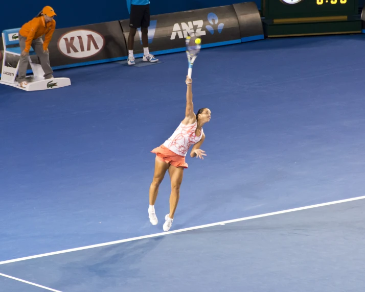 a tennis player is trying to hit the ball