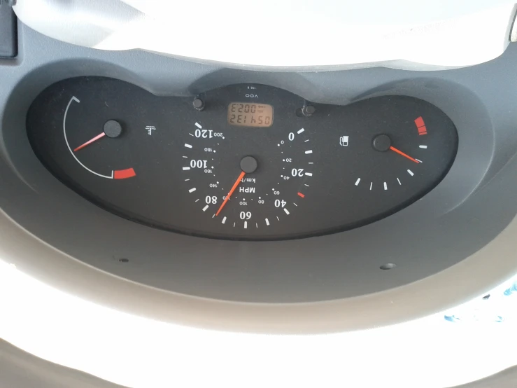 dashboard gauges for cars, and the meter is lit