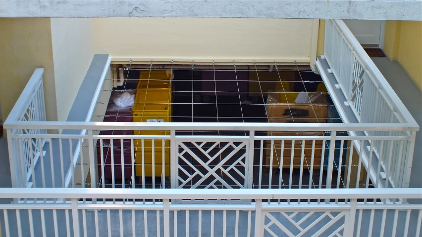 a balcony with lots of luggage on top of it