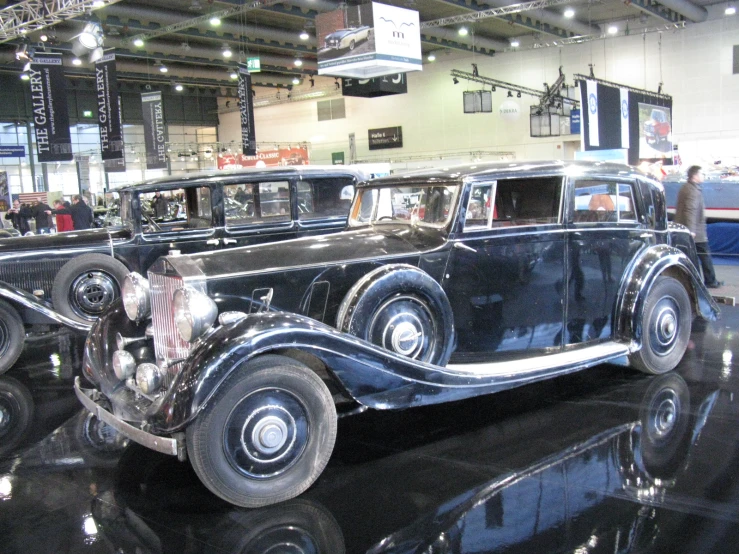 an old timey car on display inside of a building