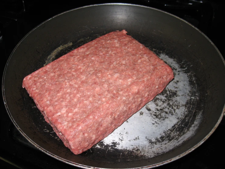 food that is in a black frying pan on the stove