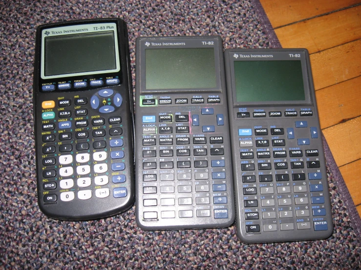 two calculators, one is black and one is blue