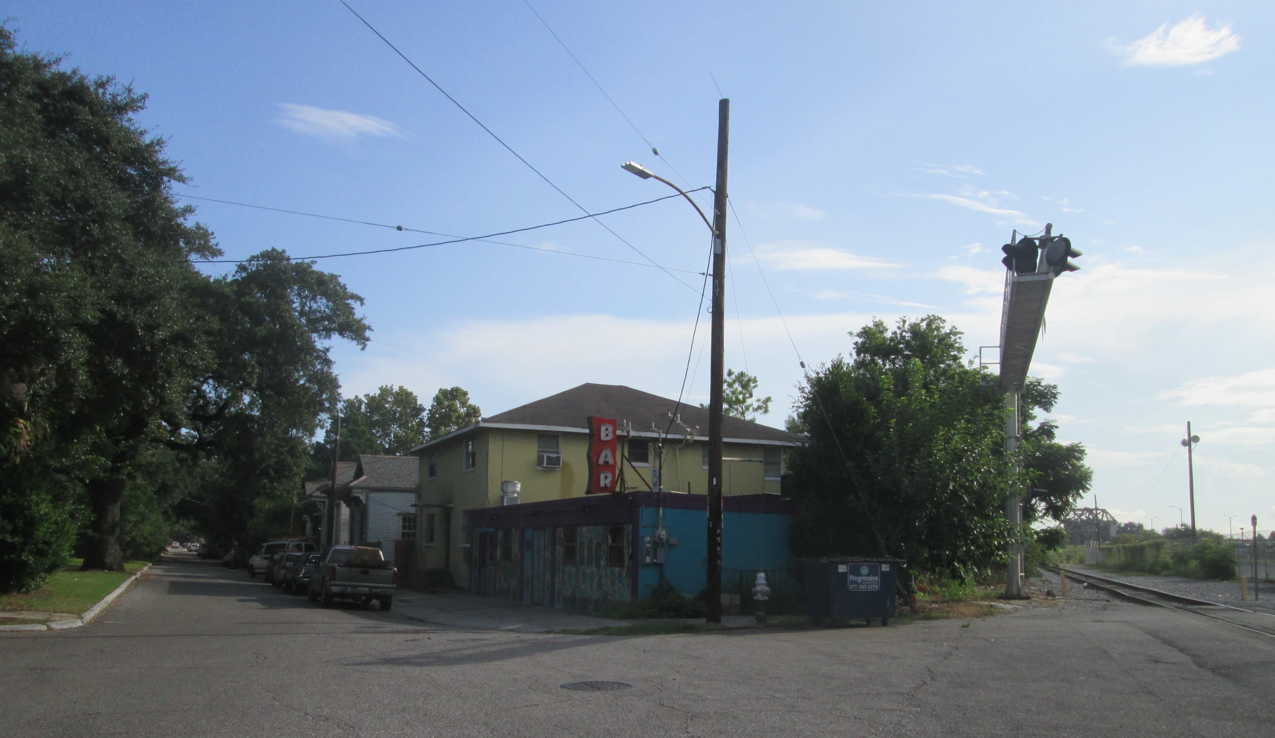 the corner of an intersection with a telephone pole and street signs