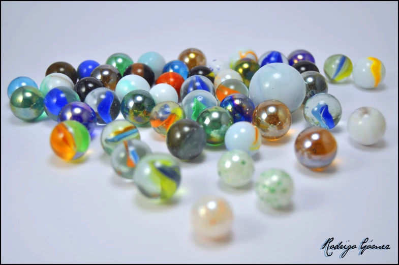 an image of marbles all around on white surface