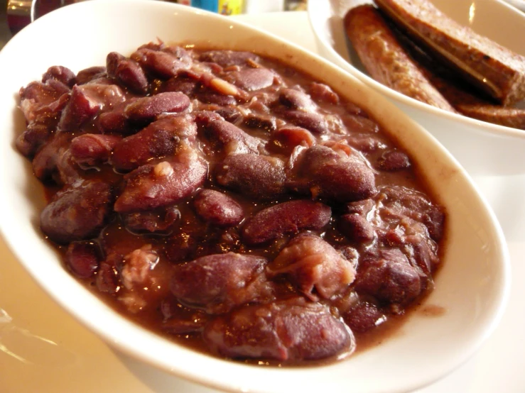 some food is in a white bowl and on the table