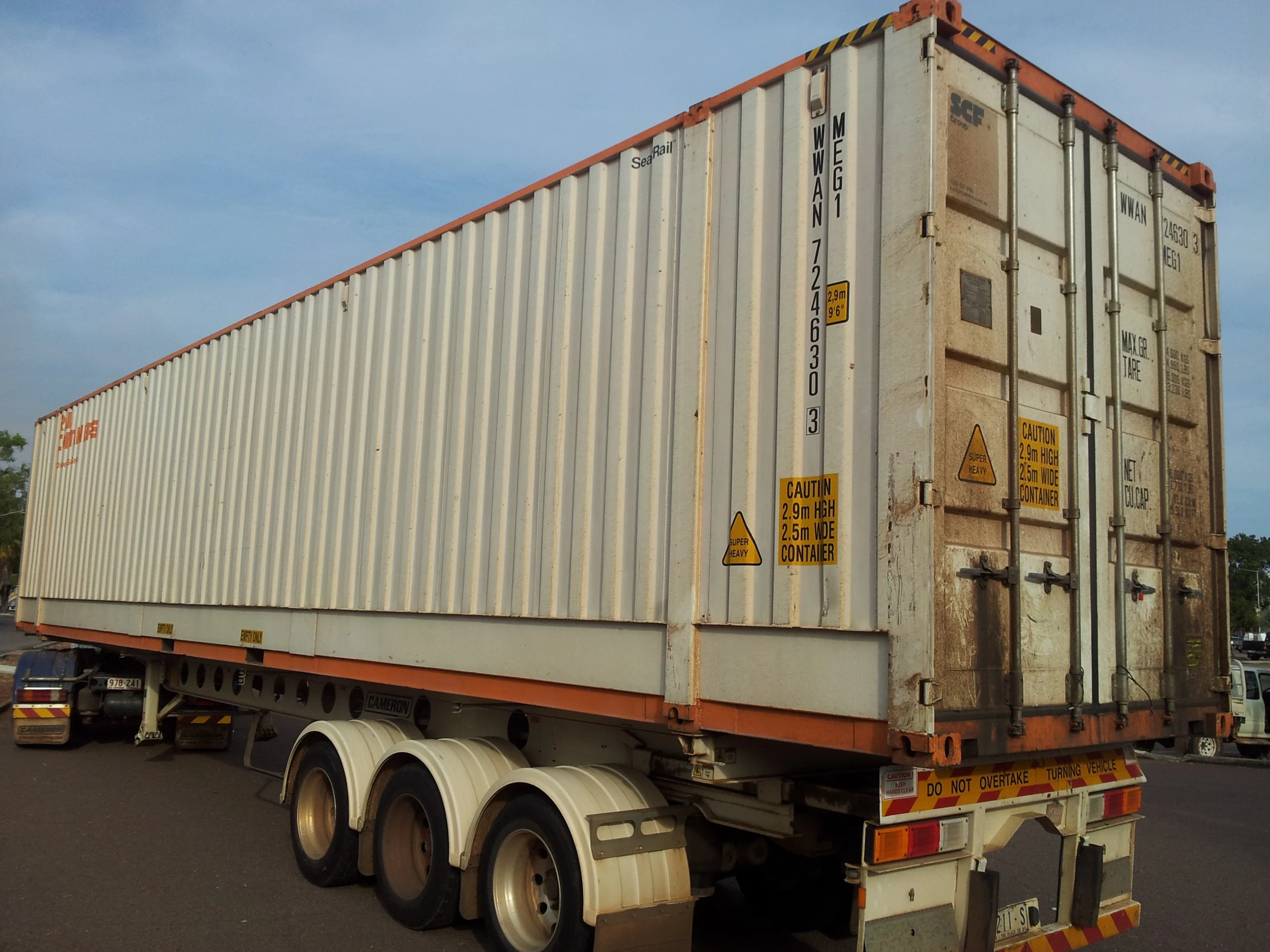 a large truck with semi cab pulled into a parking lot