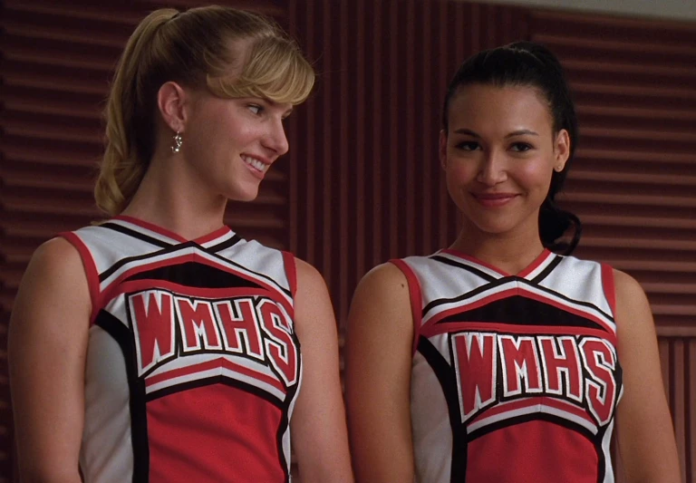 two s dressed in cheerleader outfits