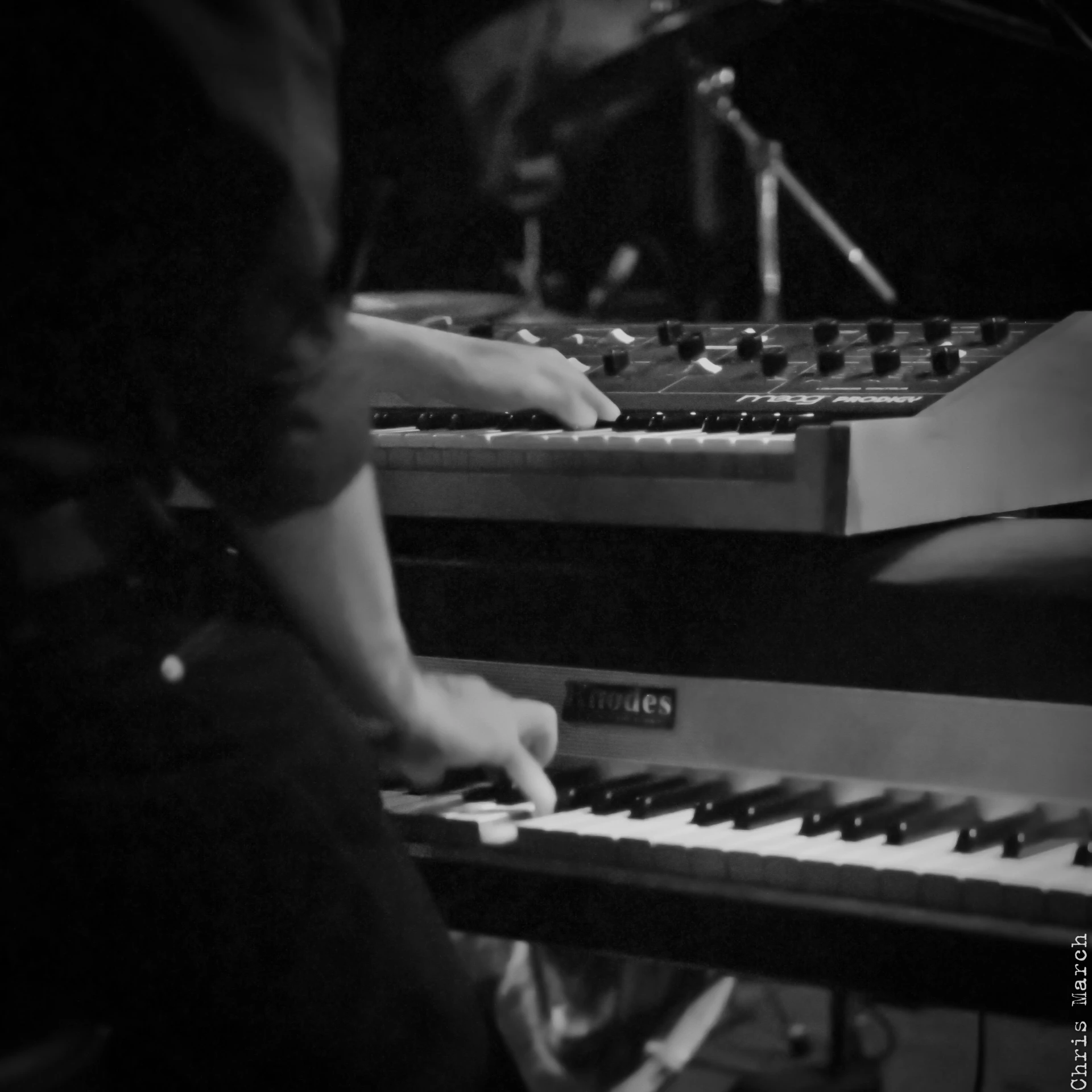 someone playing the piano at a sound studio