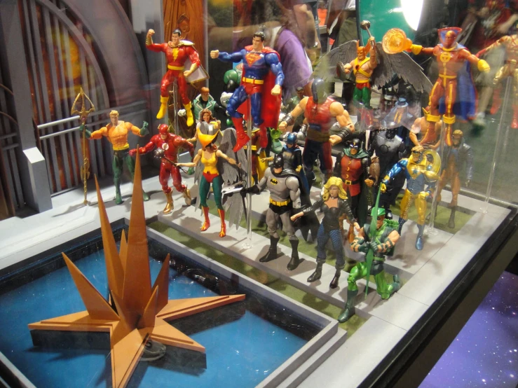 a toy display case holds various action toys