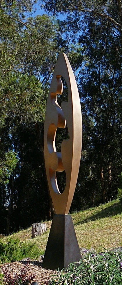 there is a large metal sculpture in the park