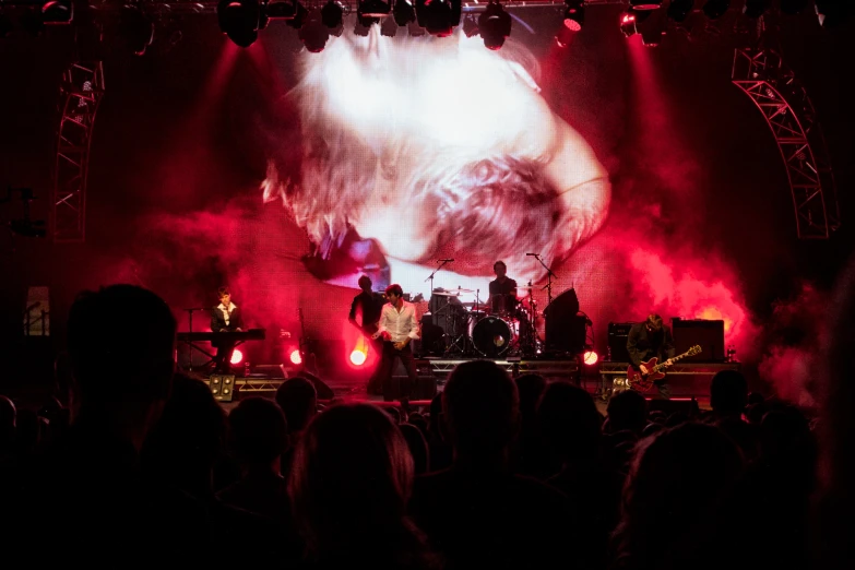 the stage is full of fans and a band