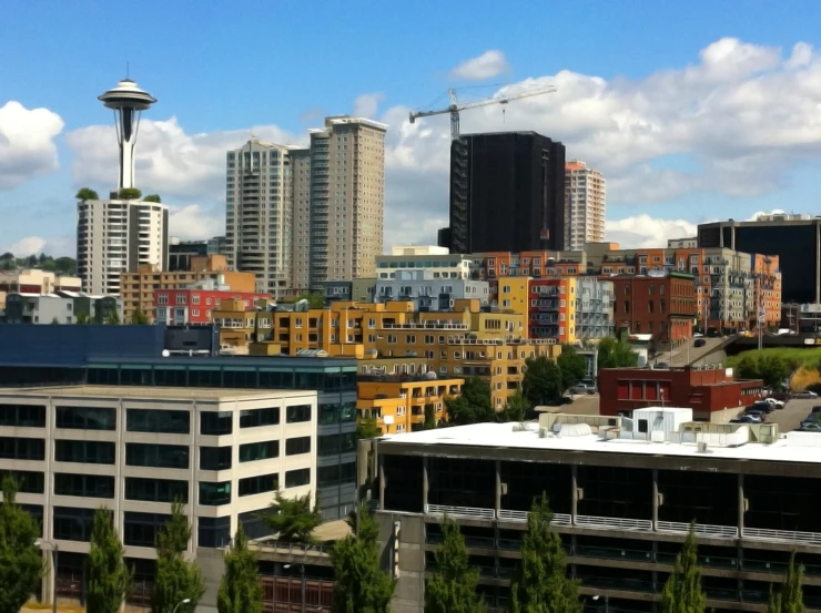 an overview of a city and a large tower in the background