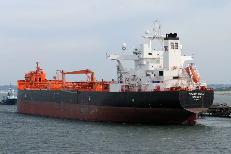 a large cargo ship docked near a dock