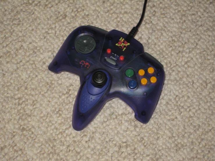 a gaming controller sitting on top of a rug