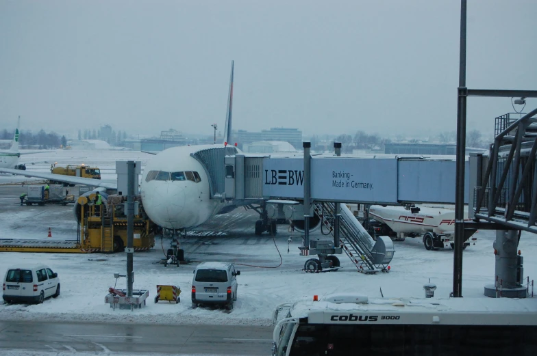 a large jet liner sitting on top of an airport runway