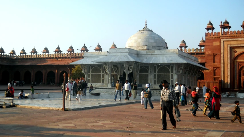 a group of people walking around a square