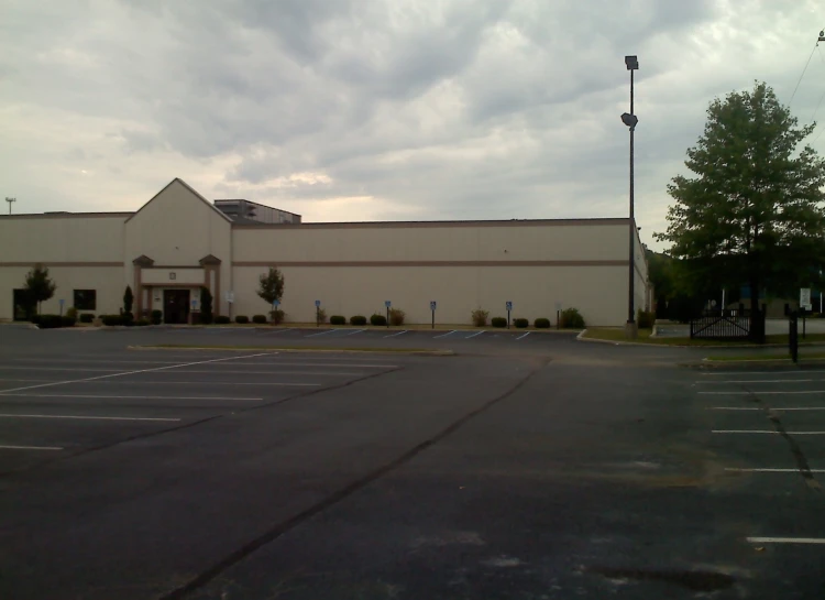 there is a building that is in the middle of the parking lot