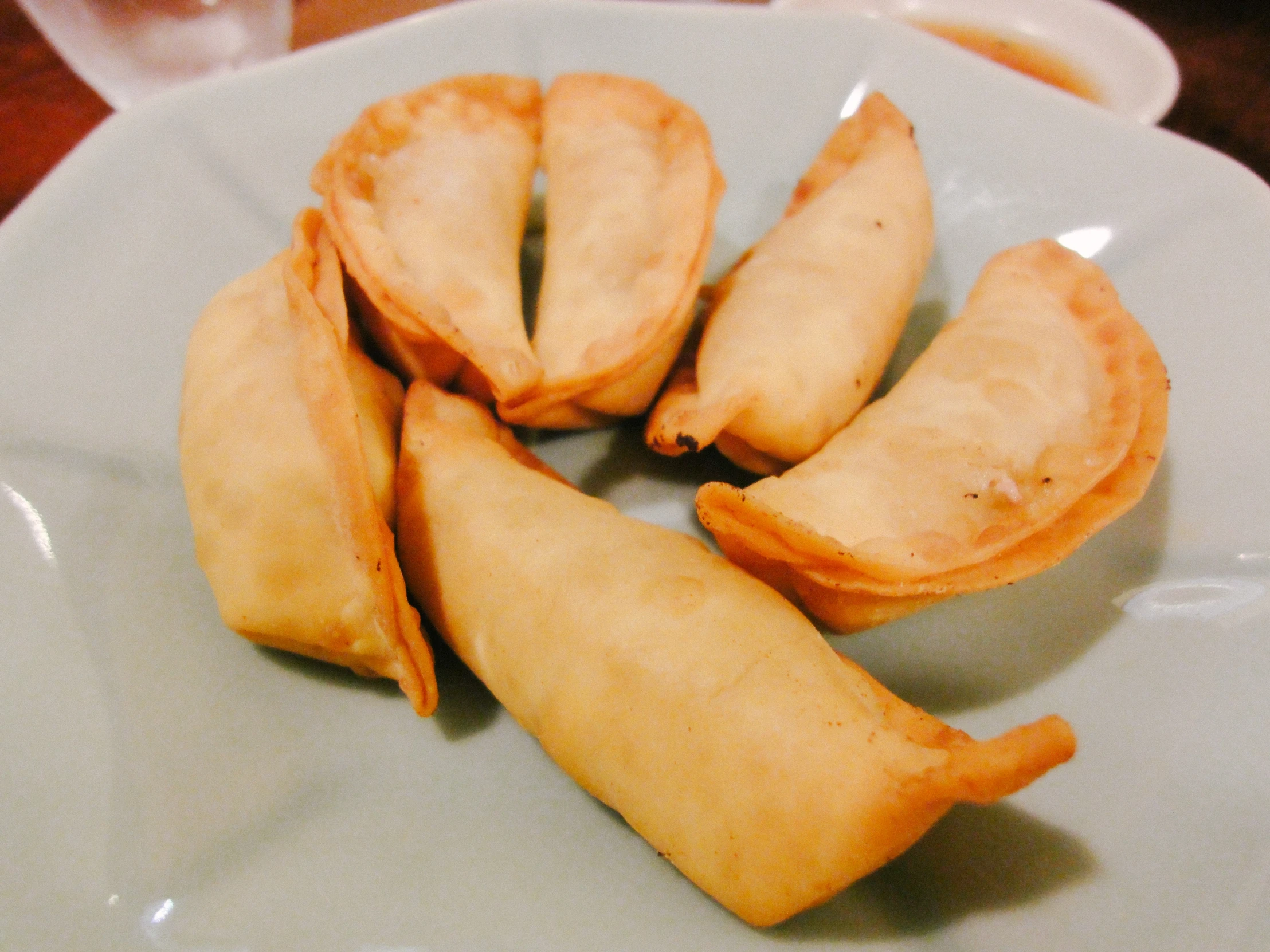 a plate filled with food that looks like apple turnover