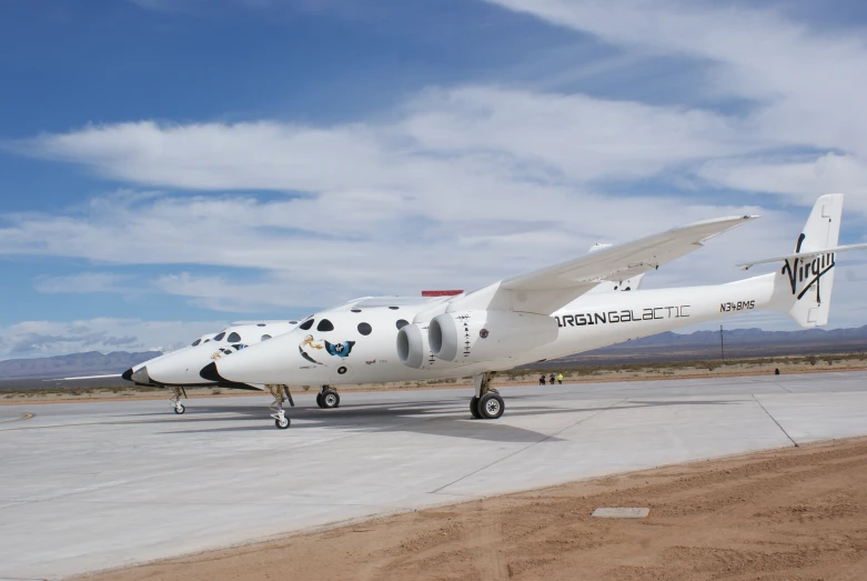 a white airplane is on display in an airport